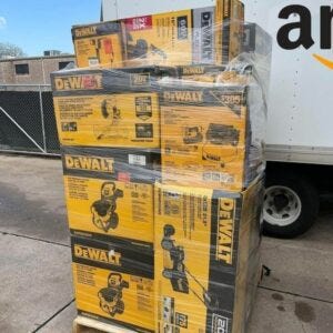 Wholesale mixed electronics pallet shrink wrapped in warehouse ready for shipping.