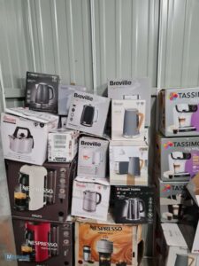 Wholesale household appliances pallet shrink wrapped in warehouse ready for shipping.