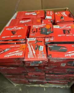 Pallet of Milwaukee M18 Fuel power tools shrink wrapped in warehouse.